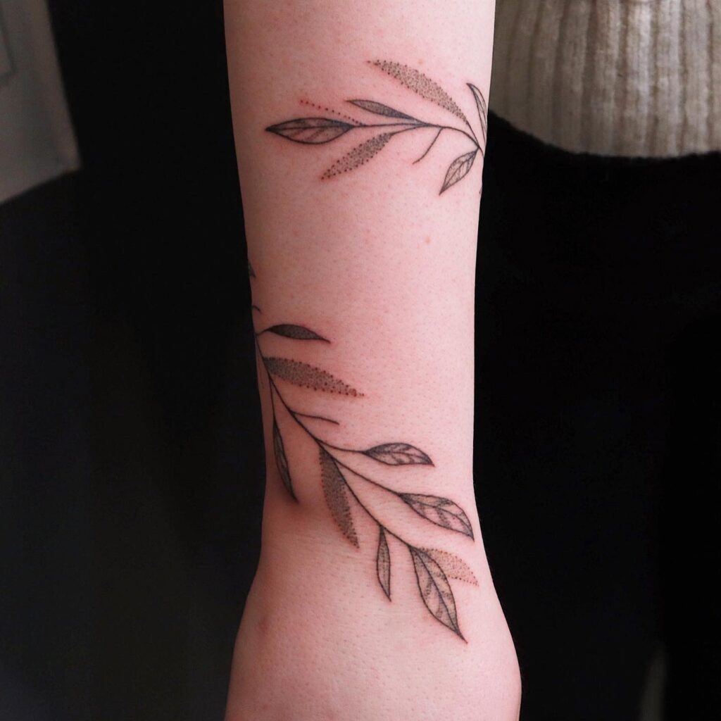 Wraparound Arm Tattoo